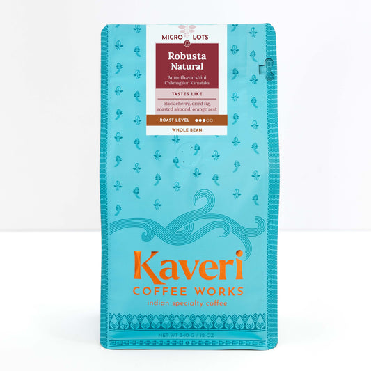 Amruthavarshini Robusta Natural. Single origin, Specialty Indian Coffee. Tasting notes include black cherry, dried fig, roasted almond, orange zest with full-bodied and smooth finish.