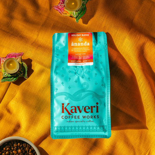 Kaveri Coffee Works holiday blend package on a yellow fabric background