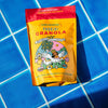 Bag of Granola on a blue tiled surface