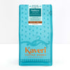 A package of Kaveri Coffee Works Peaberry whole bean coffee, featuring a bright turquoise blue bag with orange and white text and decorative patterns.